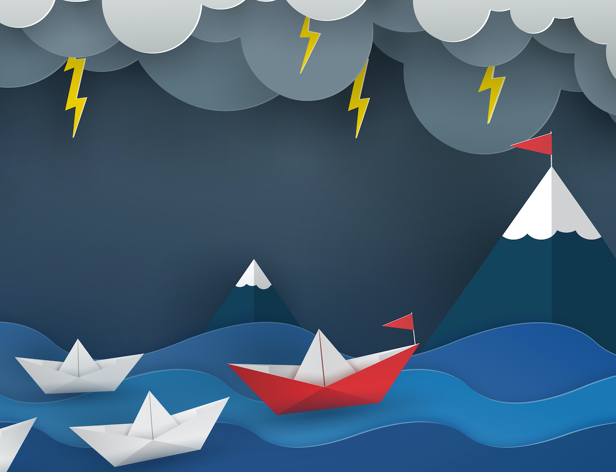Image of boat leading other boats in storm